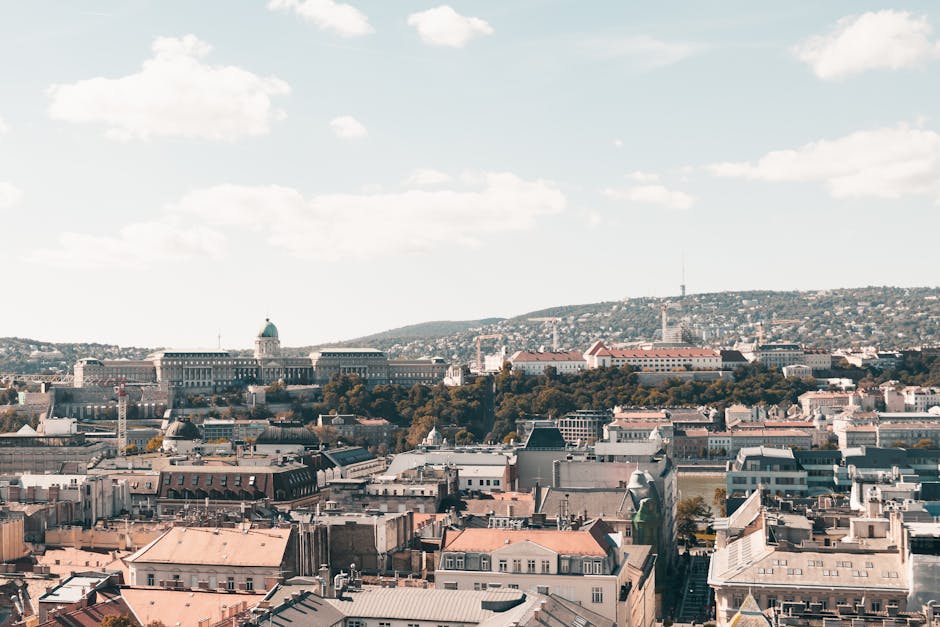 Expansive view of Budapest architecture with historic landmarks in clear daylight.