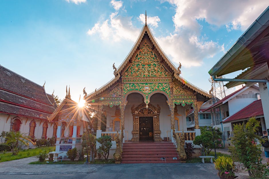 Beautiful ornate temple facade with sunburst at Wat Chiang Man, showcasing traditional Thai architecture.