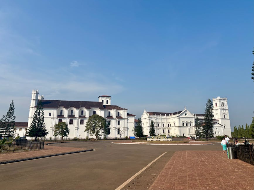 Beautiful view of Se Cathedral, a historic landmark in Old Goa, under a bright blue sky.