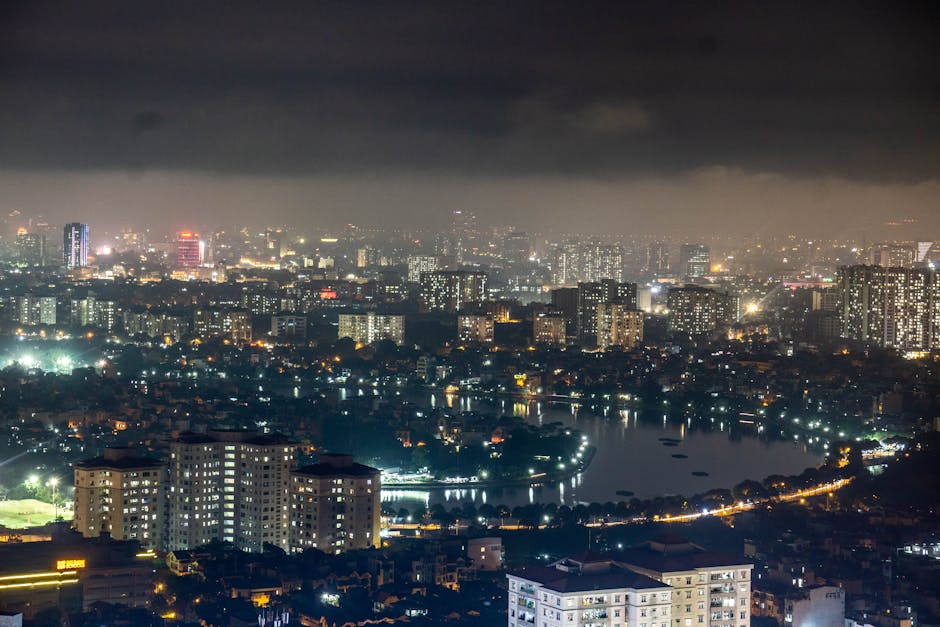 Stunning aerial view of Hanoi cityscape at night showing the vibrant urban landscape with illuminated buildings.