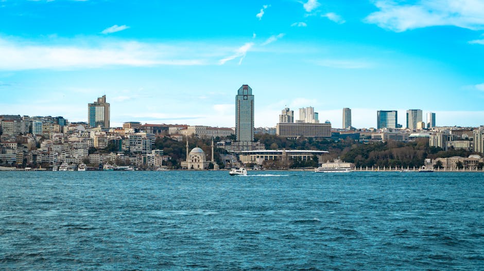 A stunning cityscape of Istanbul's skyline viewed across the Bosphorus, showcasing modern and historical architecture.