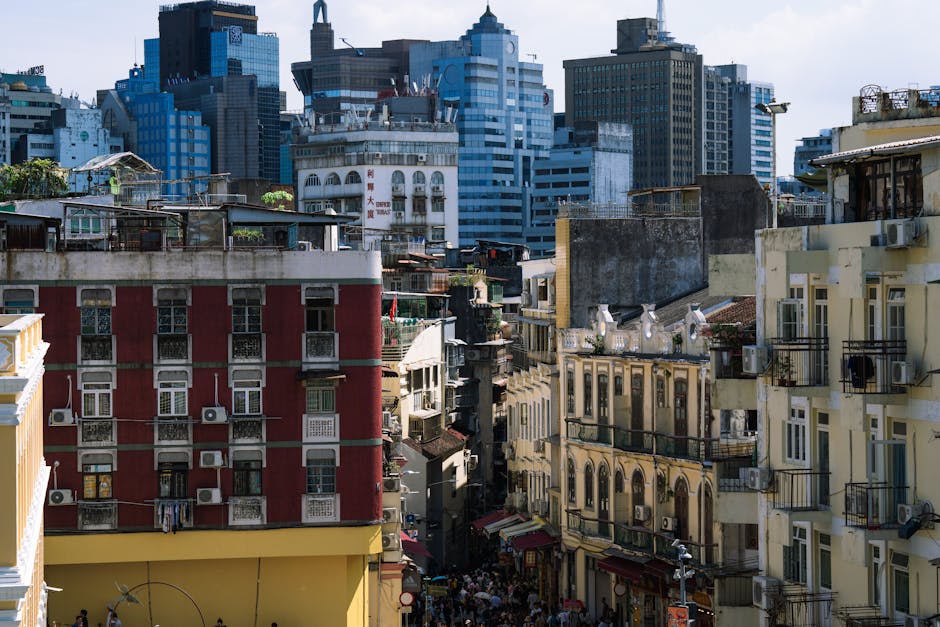 Vibrant view of Macau's contrast between historic architecture and modern skyscrapers.