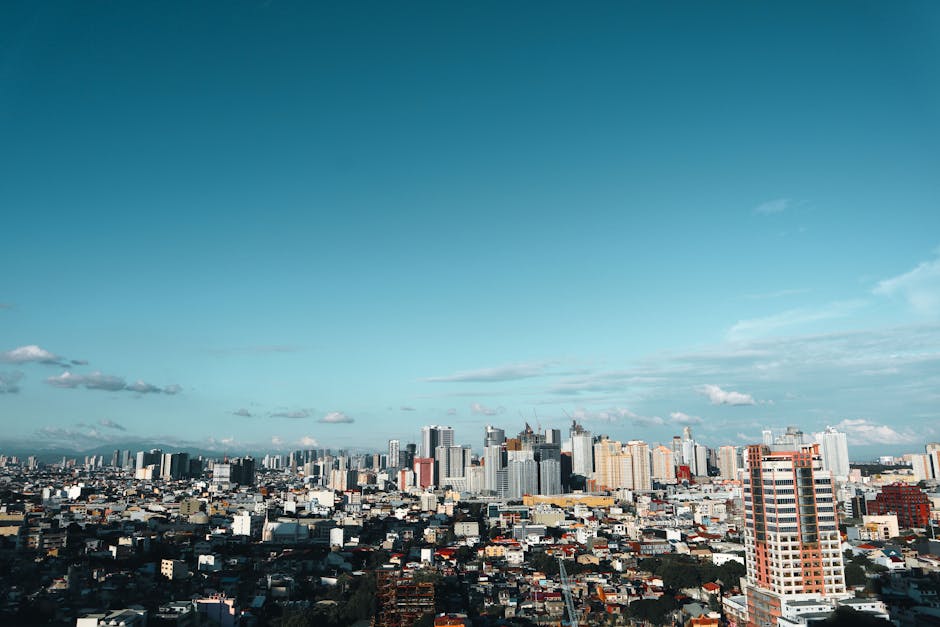 Stunning view of the Manila cityscape with modern skyscrapers under a clear blue sky.