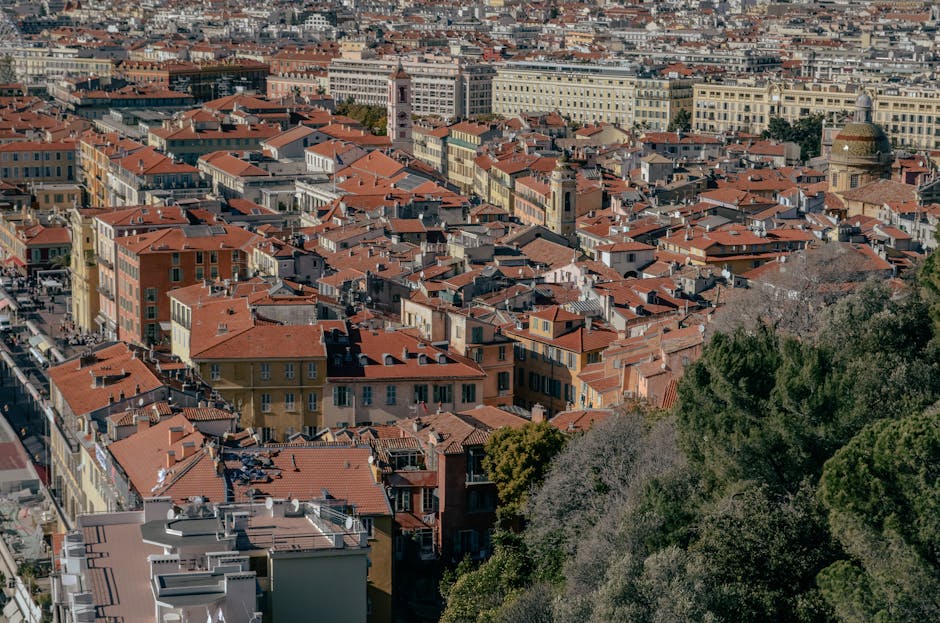 Aerial view of traditional architecture and red rooftops in Nice, France.