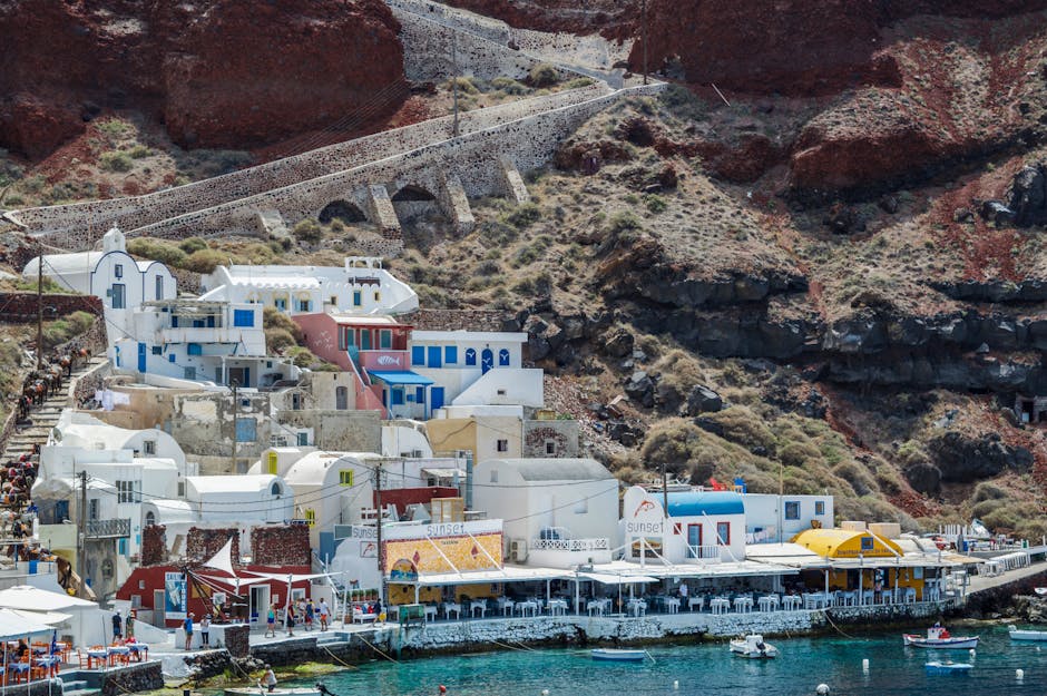 Picturesque harbor scene with traditional architecture in Santorini, Greece.