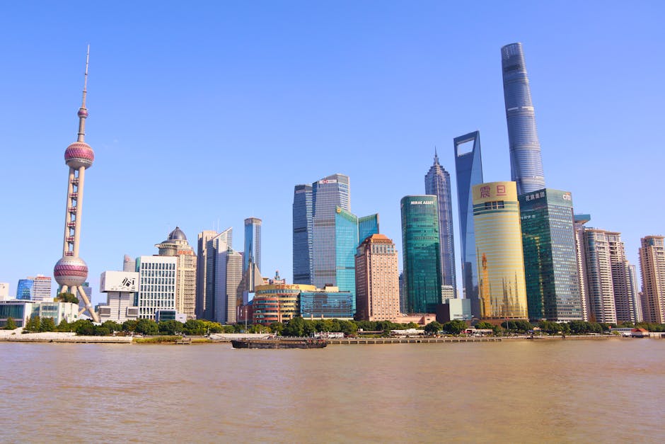 Stunning view of Shanghai's modern skyline featuring the iconic Oriental Pearl Tower on a sunny day.
