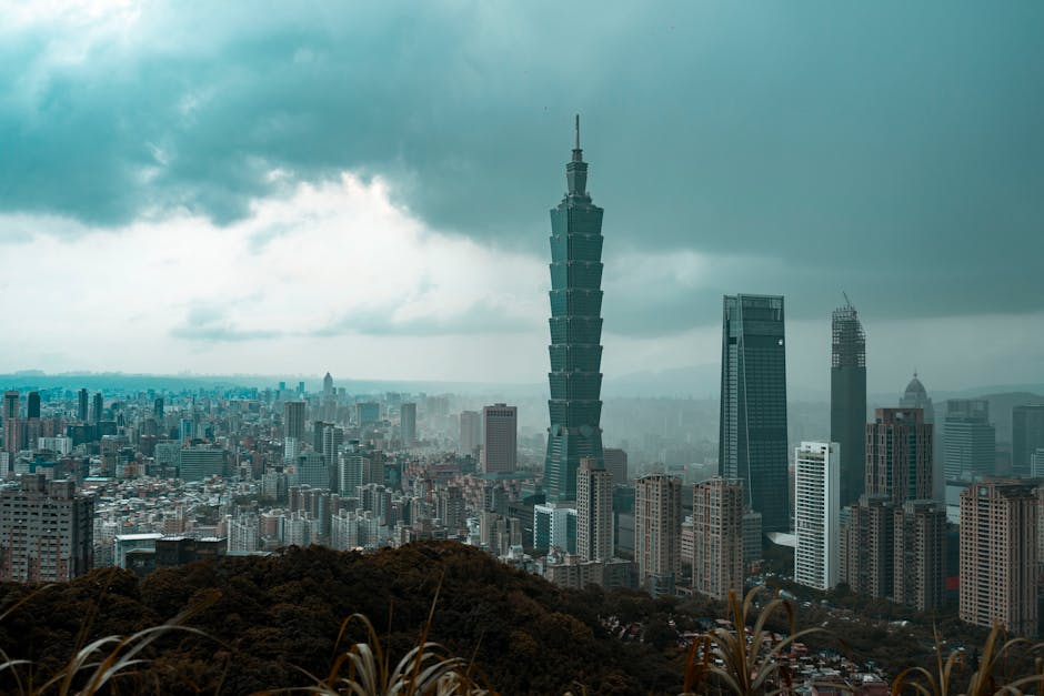 A stunning view of Taipei's skyline featuring Taipei 101 under dramatic cloud cover.