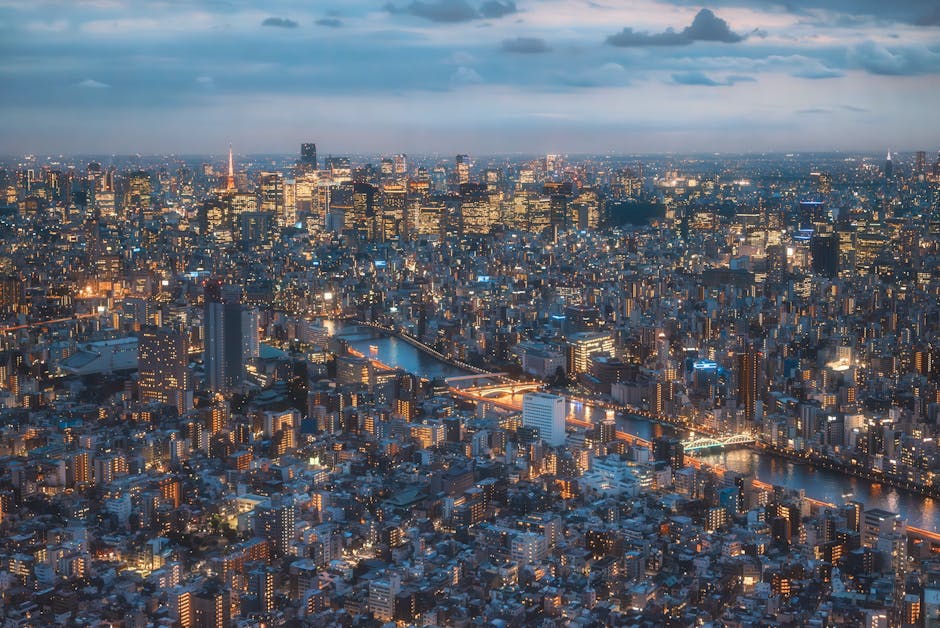A mesmerizing aerial view of Tokyo at night showcasing its iconic skyline and city lights.